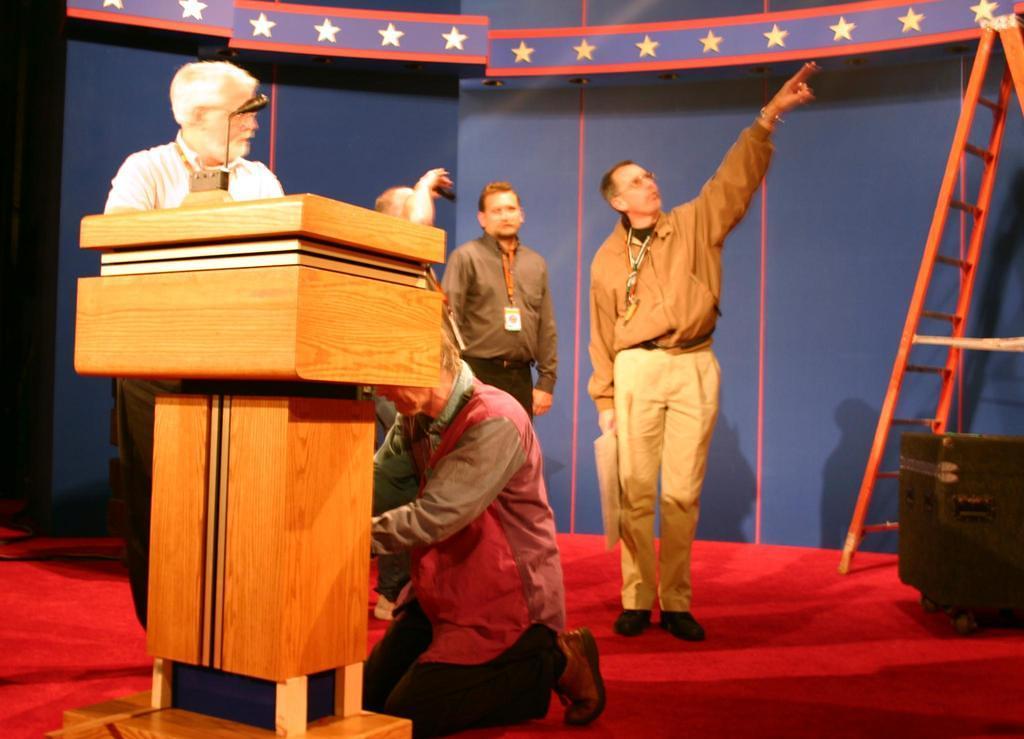 the debate director on stage Tuesday, pointing at something