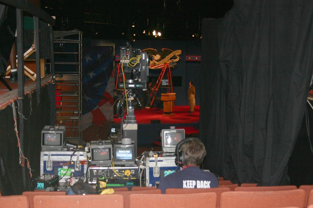 control gear and monitors next to the NBC debate hall platform, stage in the distance