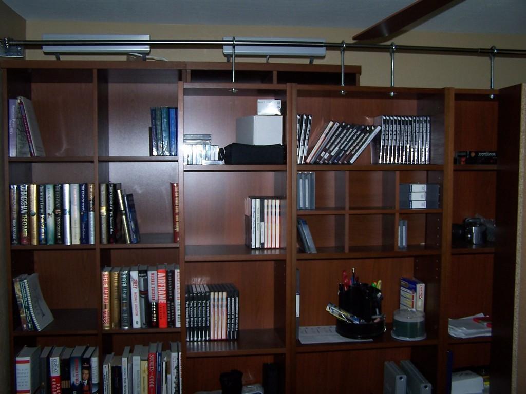 The front set of bookshelves roll on large casters.