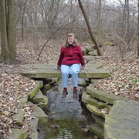 Gretchen sittin' on a lil' bridge over the "crick"